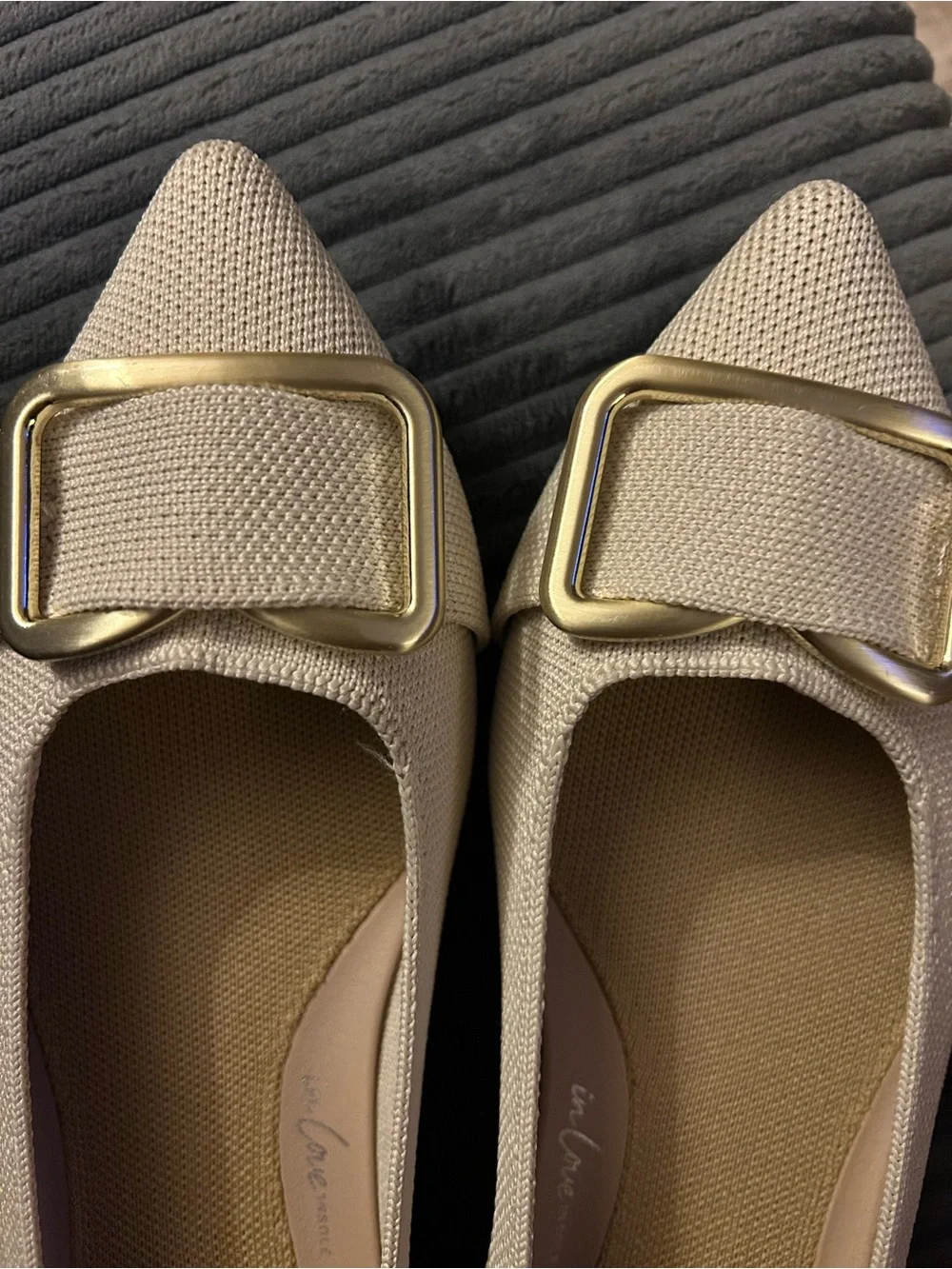 Rothy's “The Emblem Point II” pointed flats with gold hardware